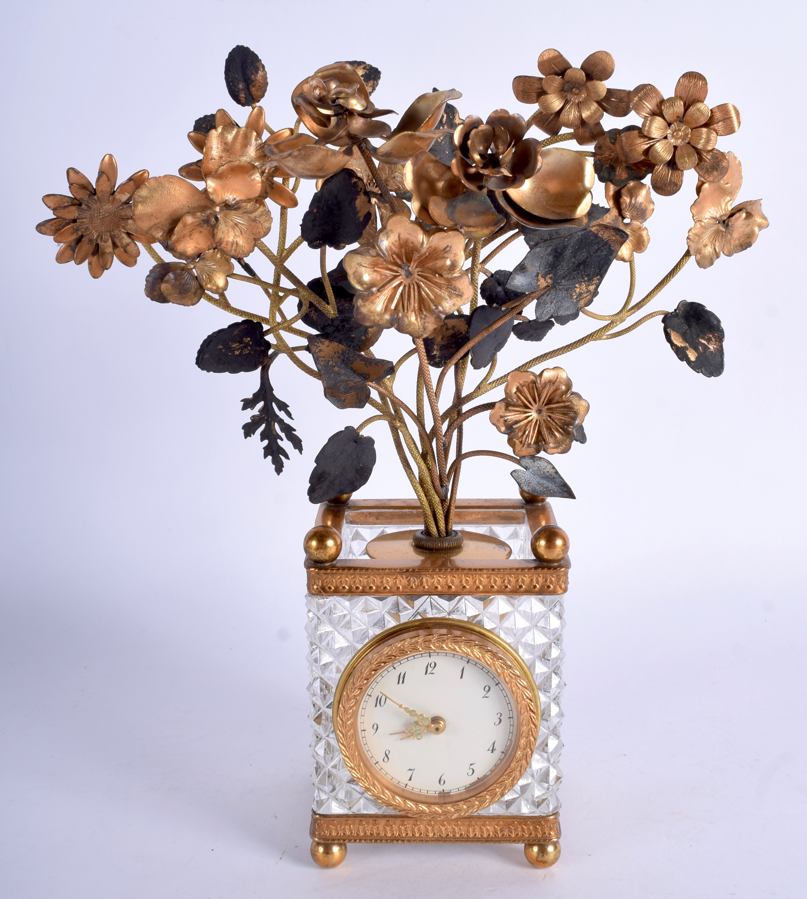 A RARE LATE 19TH CENTURY FRENCH EMPIRE STYLE GLASS AND GILT BRASS CLOCK formed as an urn of flowers