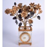 A RARE LATE 19TH CENTURY FRENCH EMPIRE STYLE GLASS AND GILT BRASS CLOCK formed as an urn of flowers