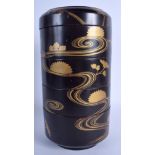 A LARGE 19TH CENTURY JAPANESE MEIJI PERIOD BLACK LACQUER STACKING BOX AND COVER painted with swirli