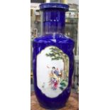 A LARGE EARLY 20TH CENTURY CHINESE BLUE GROUND ROULEAU VASE Late Qing, painted with sage in a lands