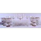 A QUANTITY OF ANTIQUE GLASSWARE, including a set of eight etched glasses with gilded rims. (qty)