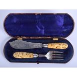 A FINE PAIR OF 19TH CENTURY CARVED INDIAN IVORY AND ENGLISH SILVER FISH SLICE AND FORK carved with
