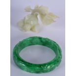 AN EARLY 20TH CENTURY CHINESE BOWENITE FISH together with a jade bangle. (2)