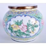 AN EARLY 20TH CENTURY CHINESE CANTON ENAMEL JAR AND COVER painted with foliage 13 cm wide.