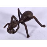 A JAPANESE BRONZE OKIMONO IN THE FORM AN ANT, formed carrying food. 5 cm wide.