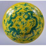 A CHINESE QING DYNASTY YELLOW AND GREEN GLAZED CIRCULAR DISH bearing Chenghua marks to base, carved