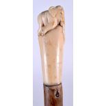 AN EARLY 20TH CENTURY IVORY TOP WALKING CANE, the terminal in the form of an elephant. 81.5 cm long