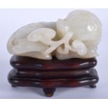 A VERY FINE 18TH CENTURY CHINESE WHITE JADE FIGURE OF A BEAST Qianlong, modelled with incised motif