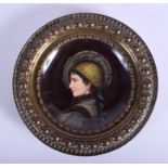 A 19TH CENTURY GERMAN PORCELAIN CIRCULAR PLAQUE painted with a female within a copper frame. 21 cm