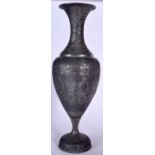 A LARGE PERSIAN WHITE METAL VASE, formed upon a pedestal foot and decorated with extensive foliage.