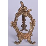 AN BRONZE ORMOLU PICTURE FRAME, formed with scrolling foliage. 11.5 cm high.