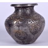 AN EARLY 20TH CENTURY PERSIAN WHITE METAL VASE, decorated with calligraphy and panels of foliage. 7