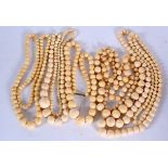 FIVE ANTIQUE IVORY NECKLACES, formed with spherical beads. Longest 102 cm. (5)