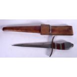 A MILITARY DAGGER, formed with a mixed composite handle and leather scabbard. 27 cm long.
