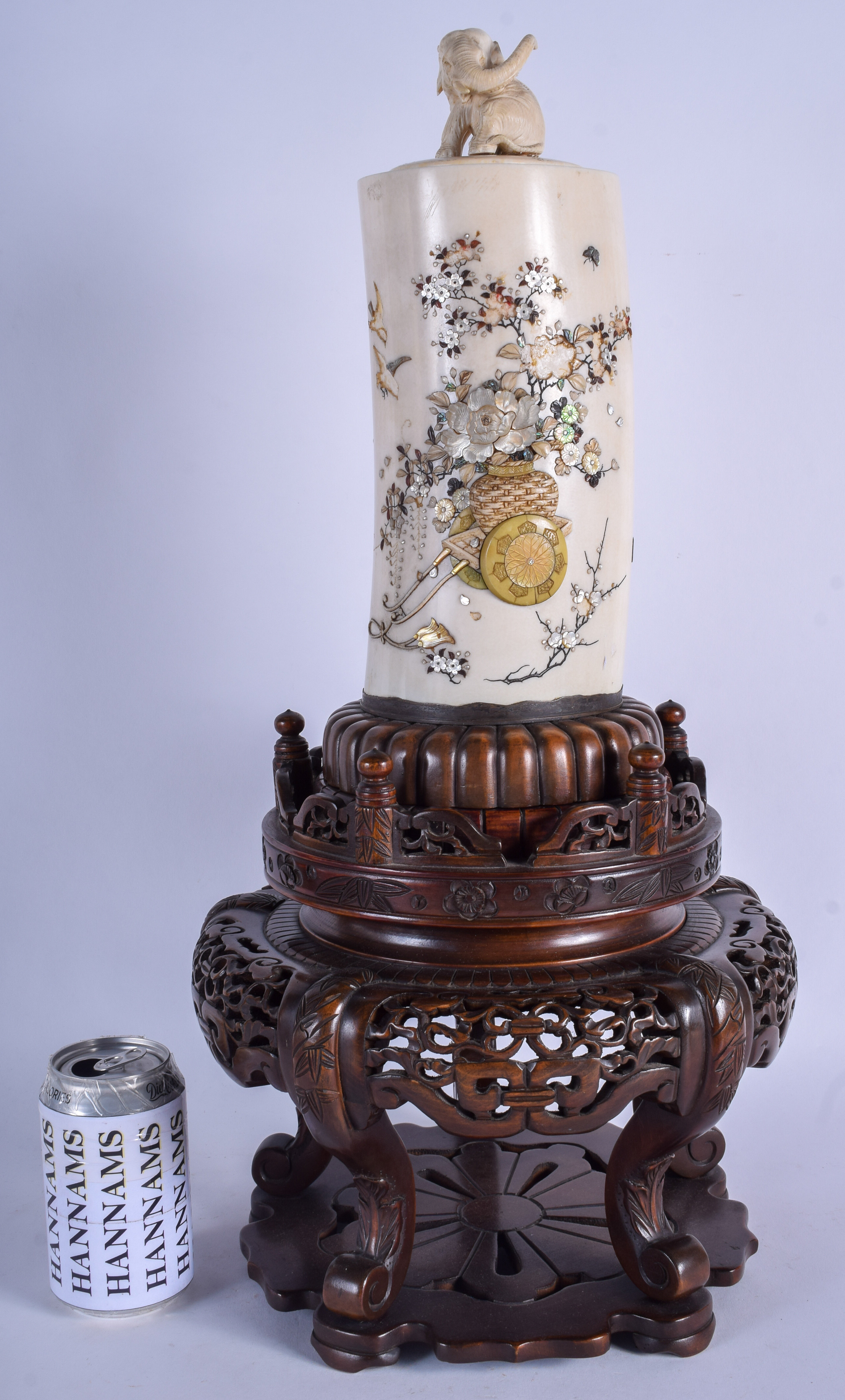 A LARGE 19TH CENTURY JAPANESE MEIJI PERIOD CARVED IVORY TUSK VASE AND COVER decorated with urns and