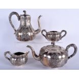 A GOOD 19TH CENTURY CHINESE EXPORT FOUR PIECE SILVER COFFEE SET decorated with foliage and trailing