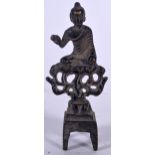 A TIBETAN BRONZE BUDDHA, formed seated upon a flaming shrine. 10.5 cm high.