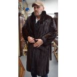 A VINTAGE FUR DRESSING GOWN, monogrammed “GM”. 110 cm x 48 cm.