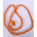 A CHINESE ORANGE BEAD NECKLACE, coral style. 92 cm long.