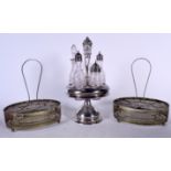 A SILVER PLATED CRUET SET, together with another pair of plated examples. Largest 37 cm high. (3)