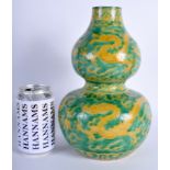 A CHINESE QING DYNASTY SANCAI GLAZED DOUBLE GOURD VASE bearing Wanli marks to base, carved with dra