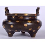 A CHINESE BRONZE GOLD SPLASH CENSER BEARING XUANDE MARKS, formed with high loop rope twist handles.