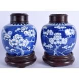 A PAIR OF 19TH CENTURY CHINESE BLUE AND WHITE GINGER JARS AND COVERS Kangxi style. 10 cm x 8 cm.