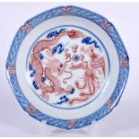 A CHINESE BLUE AND WHITE PORCELAIN DISH BEARING YONGZHENG MARKS. painted with a dragon and the phoe