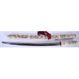 A 19TH CENTURY MEIJI PERIOD BONE SWORD decorated with figures. 83 cm long.