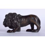 AN 18TH/19TH CENTURY EUROPEAN BRONZE FIGURE OF A LION modelled roaming. 9 cm x 5 cm.