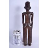 A RARE 1950S AFRICAN TRIBAL HARDWOOD FIGURE OF A COLONIAL MALE with tattoo carved face. 34 cm high.