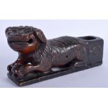 AN 18TH/19TH CENTURY CHINESE CARVED WOOD BUDDHISTIC LION probably a support from a stand. 20 cm wid