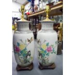 A PAIR OF CHINESE REPUBLICAN PERIOD PORCELAIN VASES converted to lamps, decorated with birds amongs