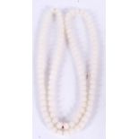 A CHINESE WHITE JADE NECKLACE, formed with spherical beads. 94 cm long.