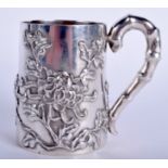 A 19TH CENTURY CHINESE EXPORT SILVER MUG by Luenwo, decorated with foliage. 108 grams. 7 cm high.