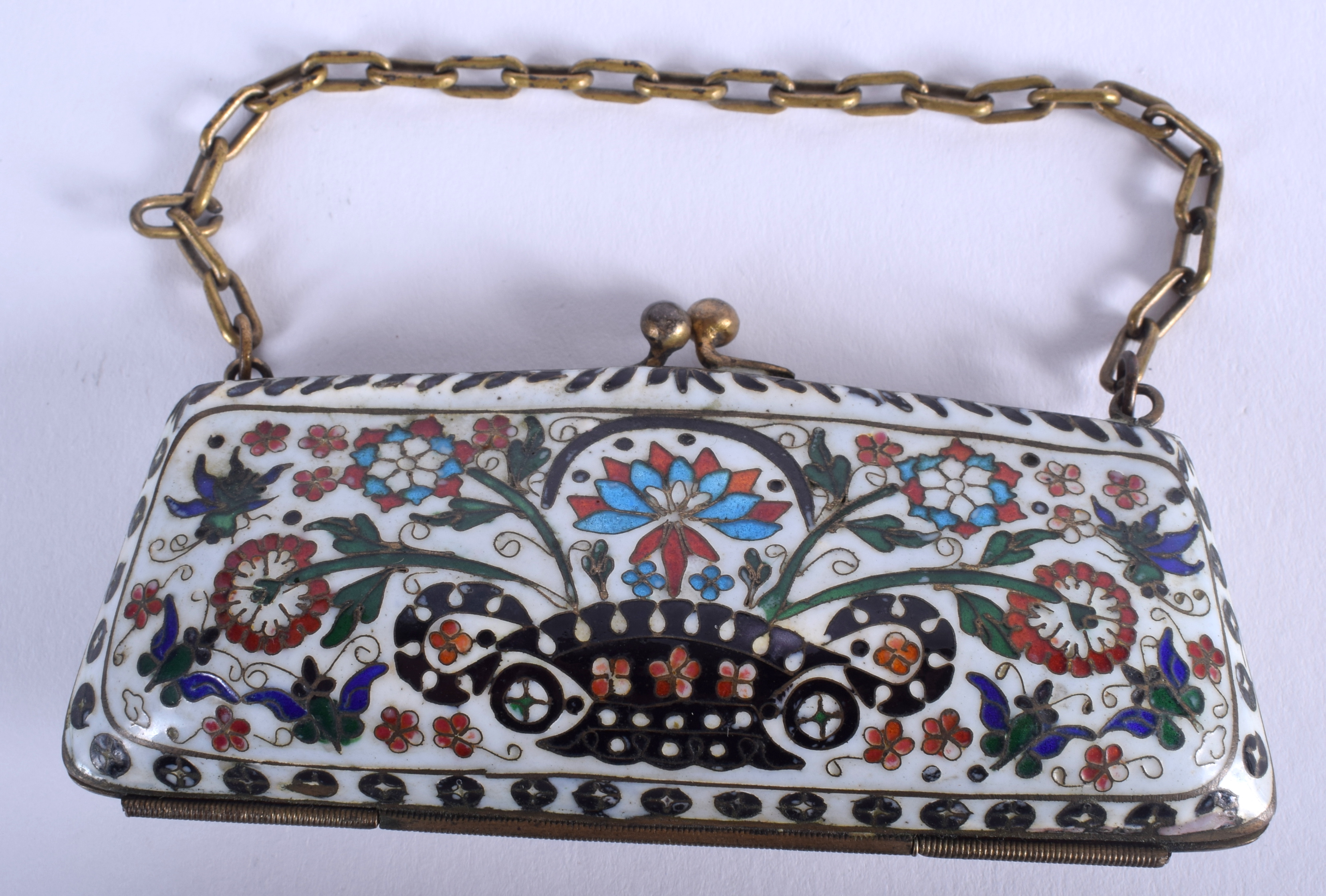 AN EARLY 20TH CENTURY CHINESE CLOISONNE ENAMEL PURSE possibly silver gilt. 11 cm x 5 cm.