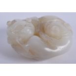 A 19TH CENTURY CHINESE GREENISH WHITE JADE FIGURE OF BEASTS Qing. 5.25 cm wide.