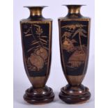 A PAIR OF JAPANESE MEIJI PERIOD KOMAI TYPE VASES, decorated with landscape scenery. 12.5 cm high.