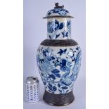 A LARGE 19TH CENTURY CHINESE BLUE AND WHITE VASE AND COVER painted with dragons amongst foliage. 46