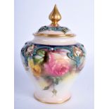 A ROYAL WORCESTER HADLEY WARE VASE AND COVER painted with rose, green mark, date code 1905. 13 cm h