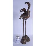 A LARGE 18TH/19TH CENTURY BRONZE FIGURE OF A BIRD modelled standing upon a naturalistic base. 60 cm