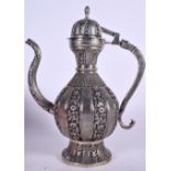 A LARGE PERSIAN WHITE METAL EWER, decorated with panels of foliage. 37 cm high.