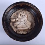 A 14TH/15TH CENTURY MIDDLE EASTERN SULTANABAD MARBLE POT LID carved as an optician. 13 cm diameter.