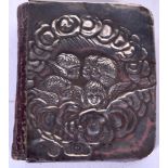 A SILVER COMMON PRAYER BOOK, decorated in relief with winged figures, Birmingham marks. 5.5 cm x 4.