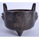 AN 18TH/19TH CENTURY CHINESE TWIN HANDLED BRONZE CENSER decorated with figures and characters. 18 c