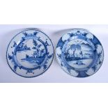 A PAIR OF 18TH CENTURY DELFT BLUE AND WHITE TIN GLAZED DISHES painted with landscapes. 34.5 cm diam