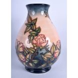 A MOORCROFT VASE possibly Briar Rose pattern. 20 cm