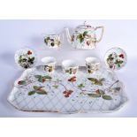 AN ANTIQUE CONTINENTAL CABARET TEASET FOR TWO decorated with a strawberry pattern. Tray 40 cm x 33