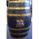 AN ANTIQUE BRASS BOUND WOODEN BARREL, formed with strap banding and painted crest. 60 cm x 35 cm.