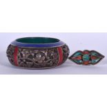 A LARGE TIBETAN LAPIS INSET BANGLE, together with a turquoise and coral inset ring. Bangle 10.5 cm